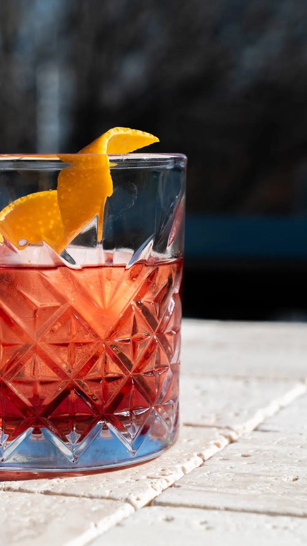 a negroni, orange twist, afternoon light