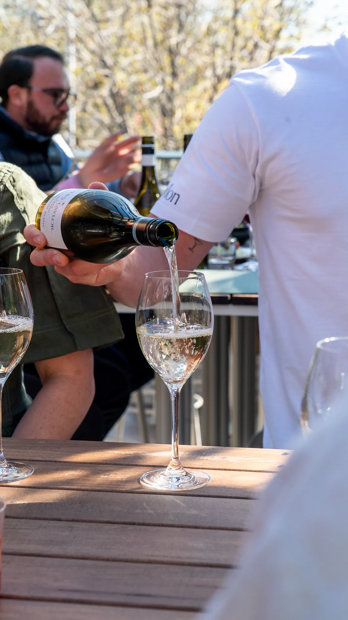 pouring wine on the terrace