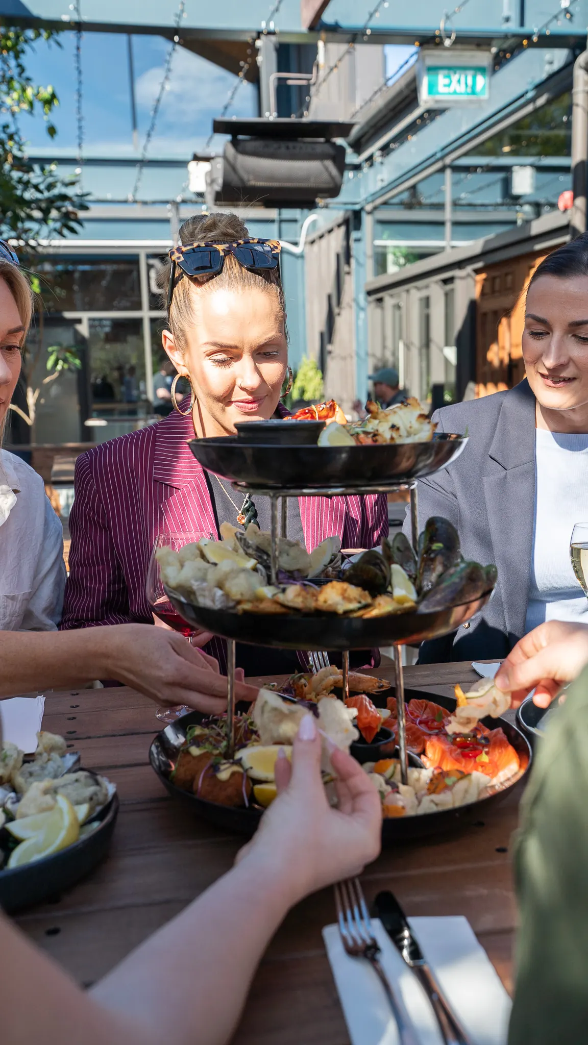 reaching for the seafood tower