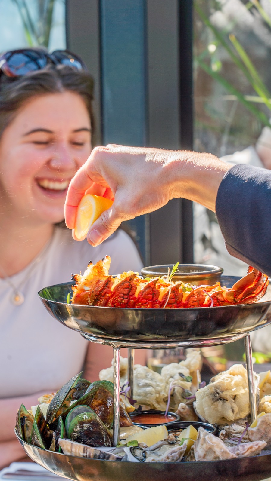 lemon squeezed over the crayfish on the seafood tower