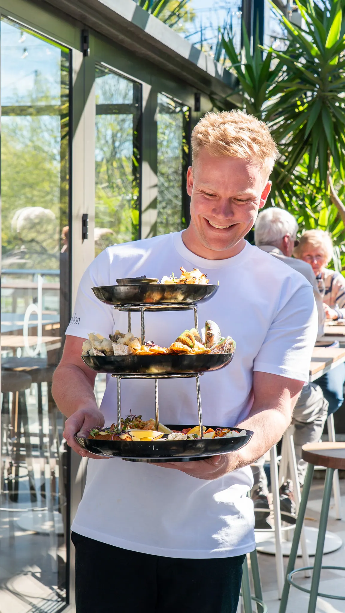 the seafood tower arriving